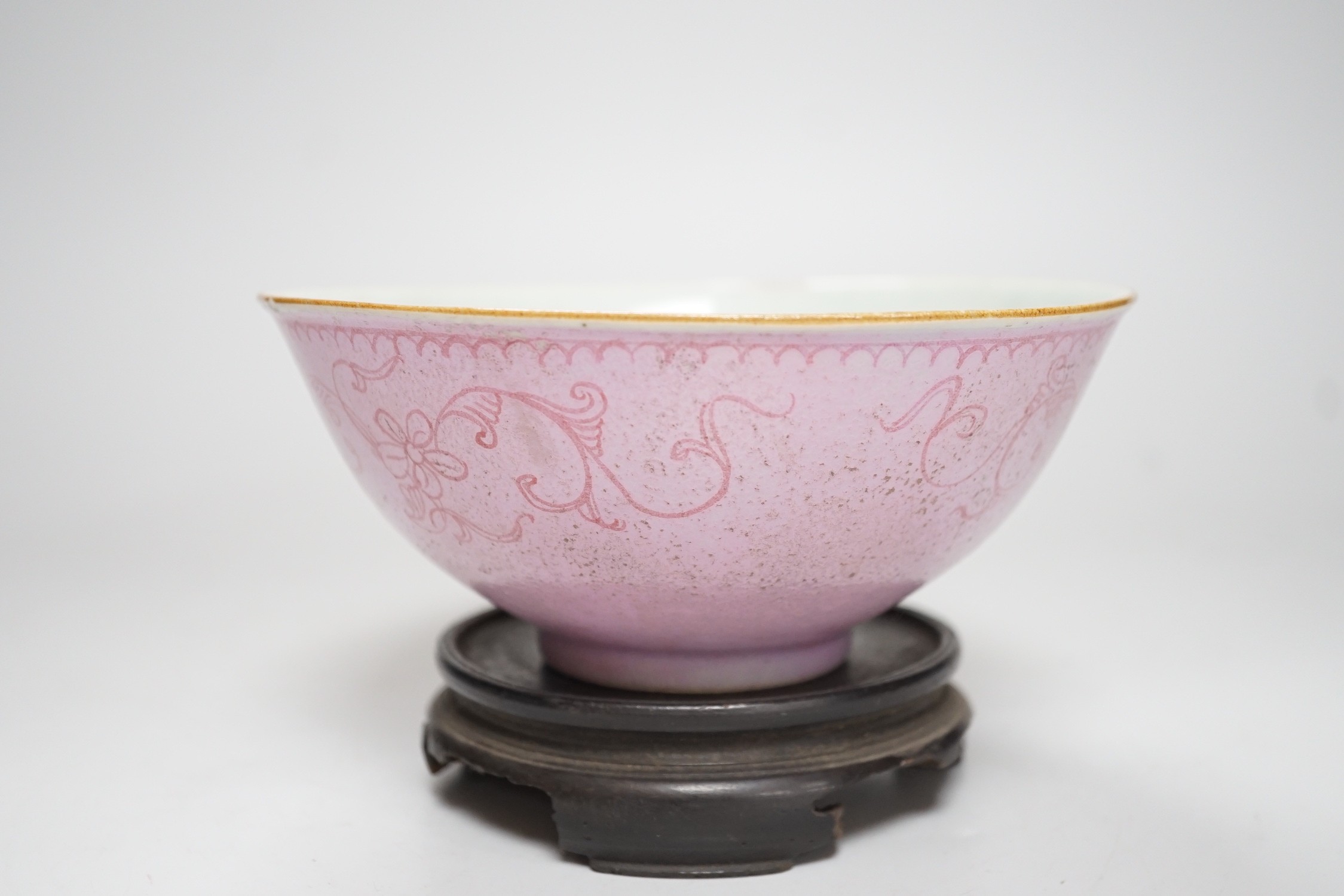 An early 19th century? Chinese powder pink ground export porcelain bowl, 17cm (a.f.), on associated pierced carved hardwood stand